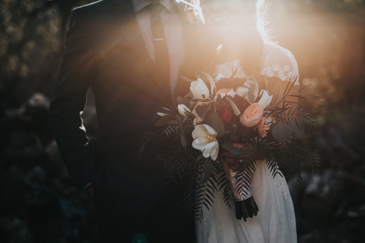 Dark moody wedding aisle — father walks daughter down aisle at second wedding not knowing why the first one ended